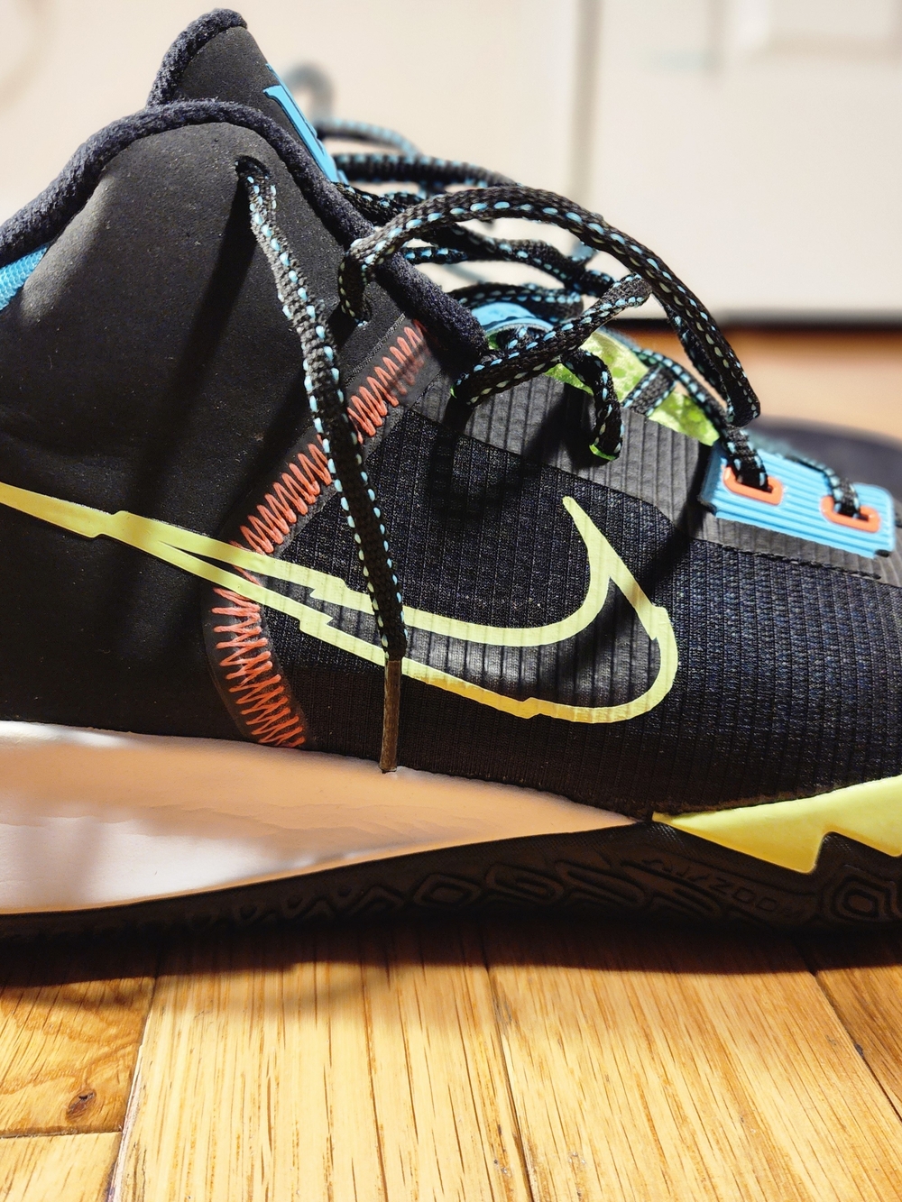 Nike Black Sneakers with Volt Swoosh and Aqua Eyelets